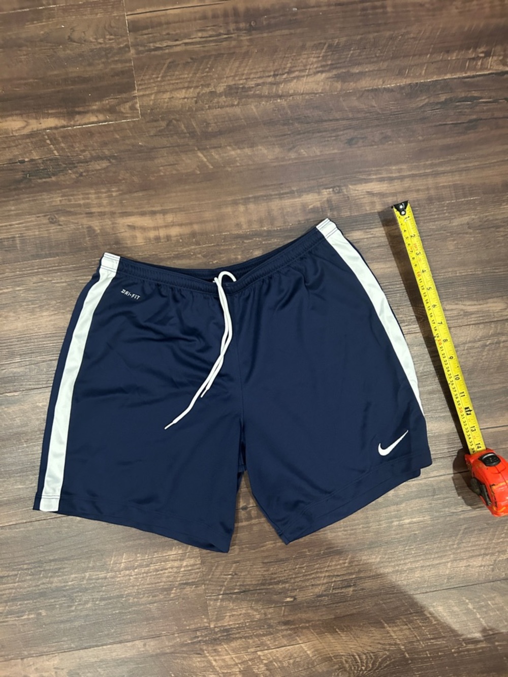 Nike Men's Navy Athletic Shorts with White Side Stripes